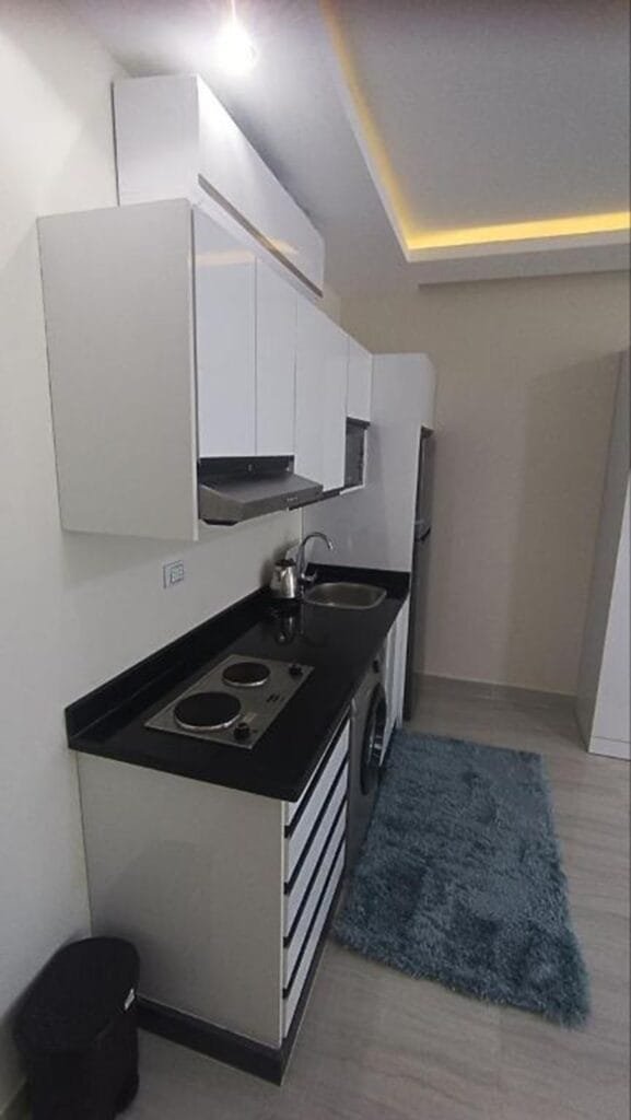 Modern compact kitchen in a deluxe studio with partial sea view in Hurghada.