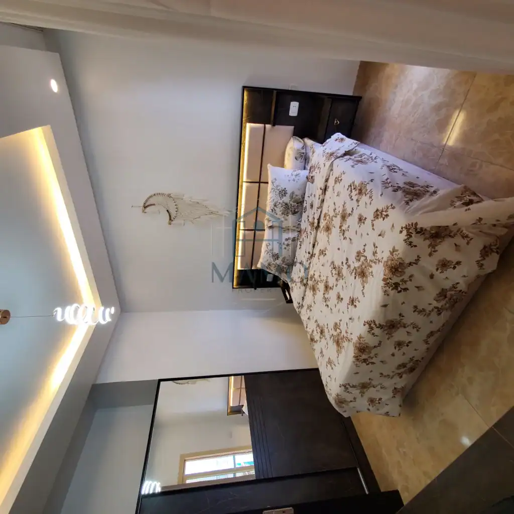 Comfortable bedroom featuring elegant decor and a large bed in a holiday apartment.